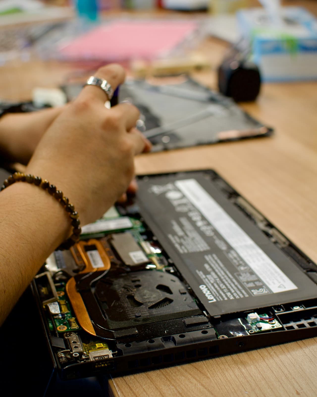 Professional laptop repair engineer at work